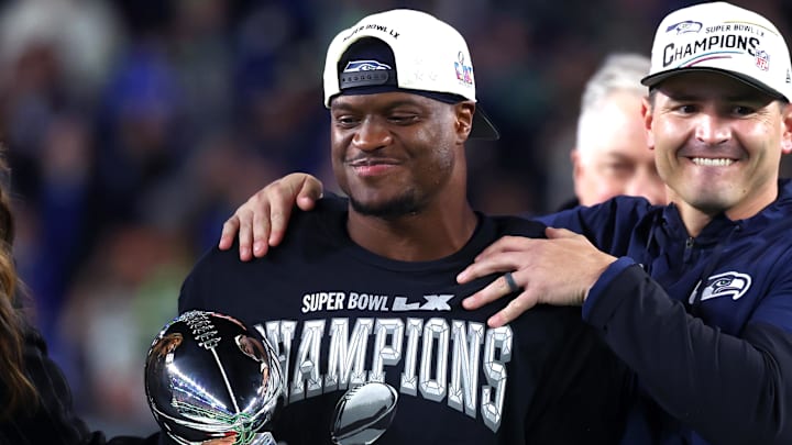Feb 8, 2026; Santa Clara, CA, USA; Seattle Seahawks head coach Mike MacDonald and running back Kenneth Walker III (9) celebrate with the Vince Lombardi trophy after defeating the New England Patriots in Super Bowl LX at Levi's Stadium. 