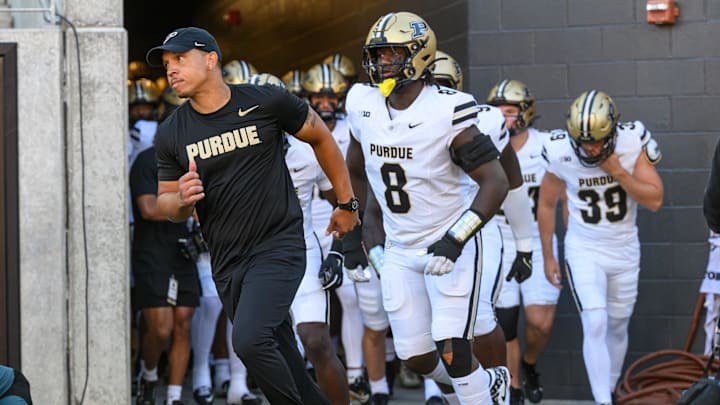 Purdue Boilermakers head coach Ryan Walters leads his team onto the field Purdue Boilermakers head coach Ryan Walters leads his team onto the field