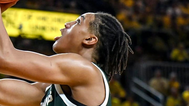 Michigan State's Jordan Scott scores against Michigan during the second half on Sunday, March 8, 2026, at the Crisler Center in Ann Arbor.