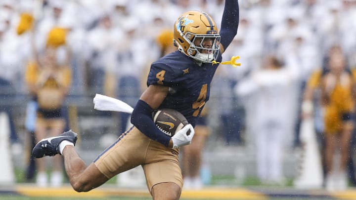 Sep 27, 2025; Morgantown, West Virginia, USA; West Virginia Mountaineers wide receiver Cam Vaughn (4) makes a catch during the first quarter against the Utah Utes at Milan Puskar Stadium. Mandatory Credit: Ben Queen-Imagn Images