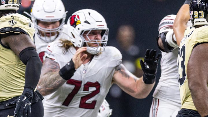 Sep 7, 2025; New Orleans, Louisiana, USA; Arizona Cardinals guard Hjalte Froholdt (72) reacts to quarterback Kyler Murray (1) having his helmet stripped off by New Orleans Saints defensive end Jonah Williams (not pictured) during the first half at Caesars Superdome. Mandatory Credit: Stephen Lew-Imagn Images