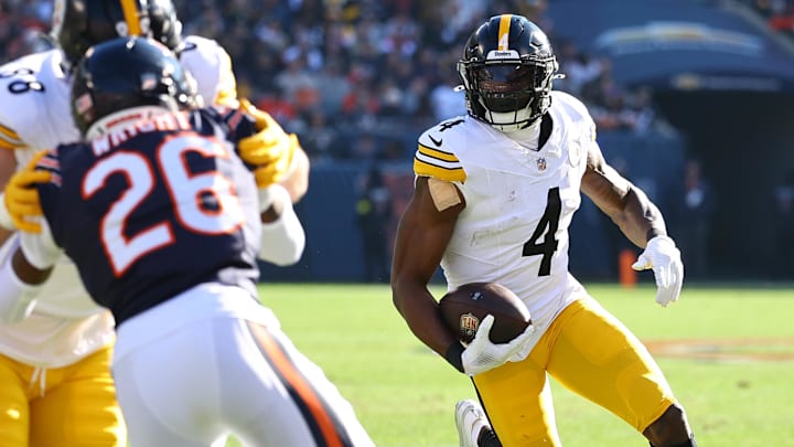 Nov 23, 2025; Chicago, Illinois, USA; Pittsburgh Steelers wide receiver DK Metcalf (4) makes a catch against the Chicago Bears during the first half at Soldier Field. Mandatory Credit: Mike Dinovo-Imagn Images