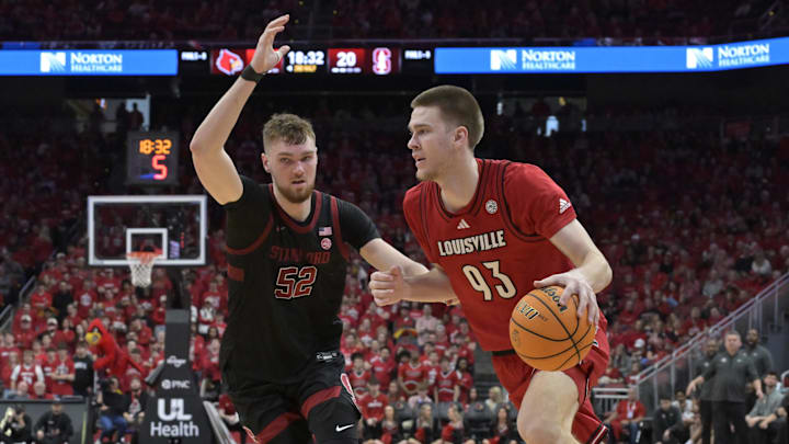 Mar 8, 2025; Louisville, Kentucky, USA; Louisville Cardinals forward Noah Waterman (93) dribbles against Stanford Cardinal forward Aidan Cammann (52) during the second half at KFC Yum! Center. Louisville defeated Stanford 68-48. Mandatory Credit: Jamie Rhodes-Imagn Images Mar 8, 2025; Louisville, Kentucky, USA; Louisville Cardinals forward Noah Waterman (93) dribbles against Stanford Cardinal forward Aidan Cammann (52) during the second half at KFC Yum! Center. Louisville defeated Stanford 68-48. Mandatory Credit: Jamie Rhodes-Imagn Images