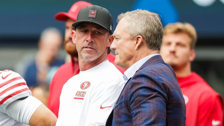 San Francisco 49ers general manager John Lynch, right, talks with head coach Kyle Shanahan.
