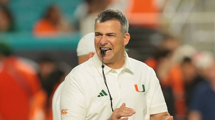 Sep 10, 2026; Miami Gardens, Florida, USA; Miami Hurricanes head coach Mario Cristobal looks on before the game against the Florida A&M Rattlers at Hard Rock Stadium. Mandatory Credit: Sam Navarro-Imagn Images Sep 10, 2026; Miami Gardens, Florida, USA; Miami Hurricanes head coach Mario Cristobal looks on before the game against the Florida A&M Rattlers at Hard Rock Stadium. Mandatory Credit: Sam Navarro-Imagn Images