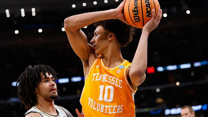 Mar 29, 2026; Chicago, IL, USA; Tennessee Volunteers forward Nate Ament (10) looks to pass while defended by Michigan Wolverines guard Elliot Cadeau (3) in the first half during an Elite Eight game of the Midwest Regional of the men's 2026 NCAA Tournament at United Center. Mandatory Credit: Kamil Krzaczynski-Imagn Images