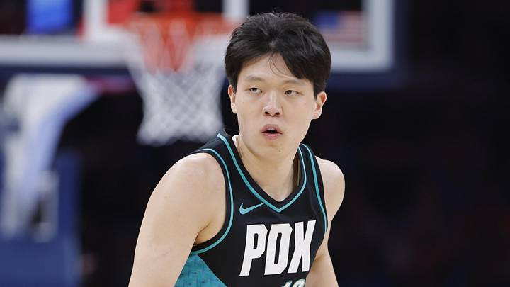 Dec 31, 2025; Oklahoma City, Oklahoma, USA; Portland Trail Blazers center Yang Hansen (16) gestures after scoring a three point basket against the Oklahoma City Thunder during the second half at Paycom Center. Mandatory Credit: Alonzo Adams-Imagn Images