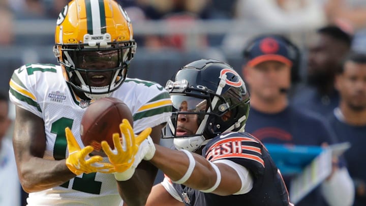 Chicago Bears cornerback Kyler Gordon (6) knocks the ball away from Green Bay Packers wide receiver Jayden Reed in 2023.