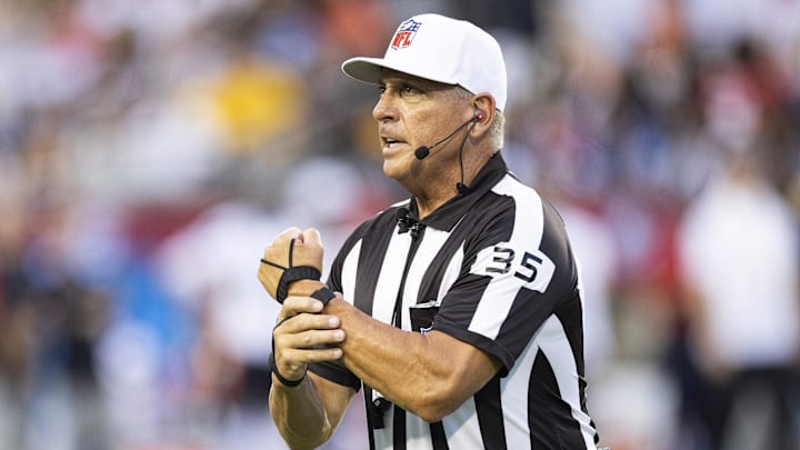 Aug 1, 2024; Canton, Ohio, USA; NFL 
referee John Hussey (35) makes a call for holding during the first quarter between the Chicago Bears and the Houston Texans at Tom Benson Hall of Fame Stadium. Mandatory Credit: Scott Galvin-Imagn Images