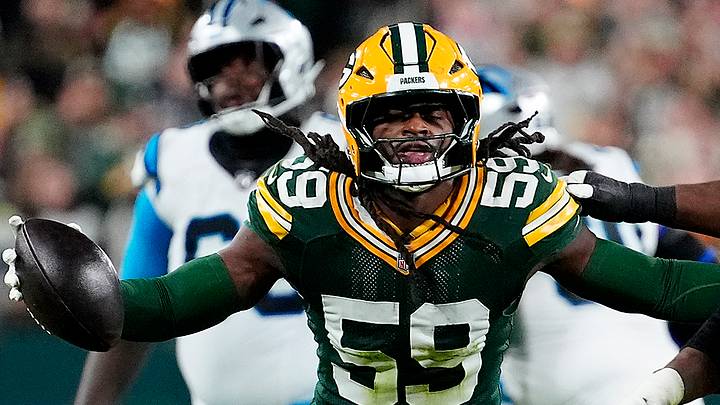 Green Bay Packers linebacker TyRon Hopper (59) celebrates an interception against the Carolina Panthers. Green Bay Packers linebacker TyRon Hopper (59) celebrates an interception against the Carolina Panthers.