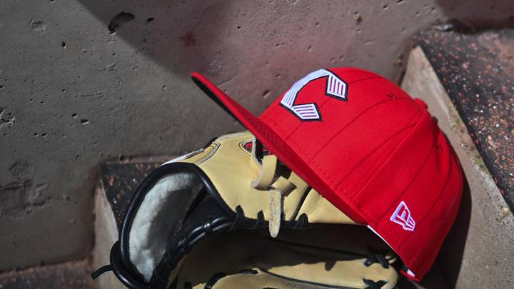Apr 11, 2026; Cincinnati, Ohio, USA;  A view of an official Cincinnati Reds hat on the dugout steps during the game against the Los Angeles Angels at Great American Ball Park. Mandatory Credit: Aaron Doster-Imagn Images
