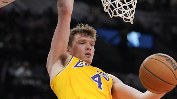 Nov 27, 2024; San Antonio, Texas, USA;  Los Angeles Lakers guard Dalton Knecht (4) dunks in the second half against the San Antonio Spurs at Frost Bank Center. Mandatory Credit: Daniel Dunn-Imagn Images