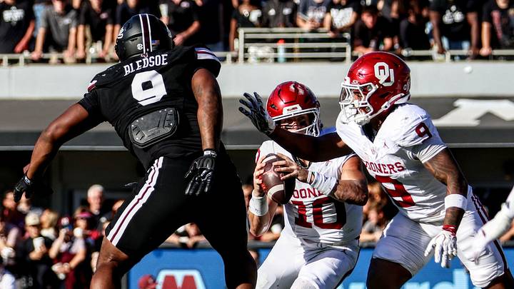 Oklahoma quarterback John Mateer scrambles against MSU as running back Lloyd Avant blocks. Oklahoma quarterback John Mateer scrambles against MSU as running back Lloyd Avant blocks.