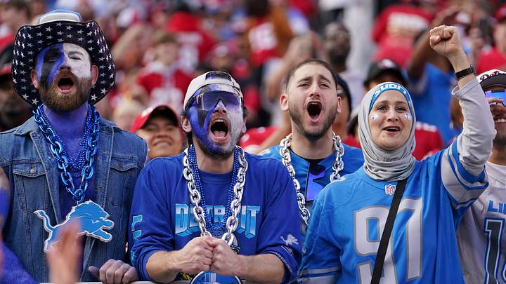 Detroit Lions fans cheer as members of the team take the field for warm ups before the start of the NFC Championship game