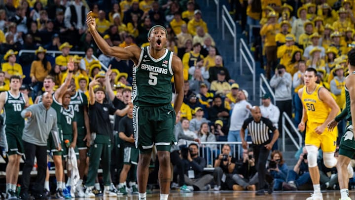 Michigan State’s Tre Holloman (5) celebrates after his team scores a basket against Michigan’s defense during the second half of their matchup at Crisler Center in Ann Arbor on Friday, Feb. 21, 2025. Michigan State’s Tre Holloman (5) celebrates after his team scores a basket against Michigan’s defense during the second half of their matchup at Crisler Center in Ann Arbor on Friday, Feb. 21, 2025.