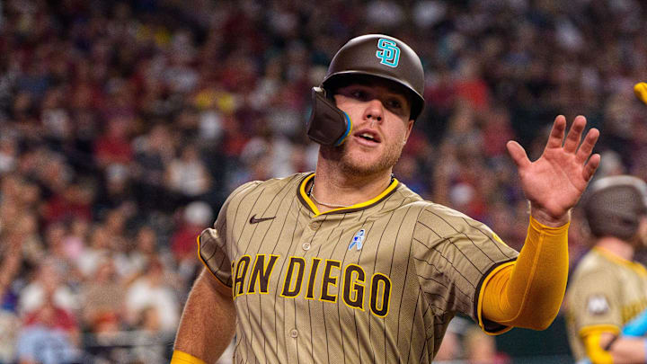 San Diego Padres outfielder Gavin Sheets (30) and infielder Jose Iglesias (7) celebrates after Sheets scores in the fourth inning against the Arizona Diamondbacks at Chase Field on June 15.