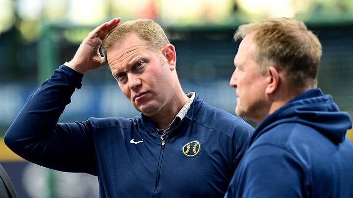 Oct 2, 2024; Milwaukee, Wisconsin, USA; Milwaukee Brewers general manager Matt Arnold talks to manager Matt Arnold before game two of the Wildcard round for the 2024 MLB Playoffs against the New York Mets at American Family Field. Mandatory Credit: Benny Sieu-Imagn Images