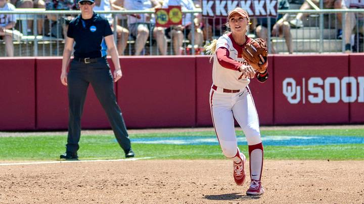 Oklahoma infielder Sydney Barker throws to first base against Kansas. Oklahoma infielder Sydney Barker throws to first base against Kansas.