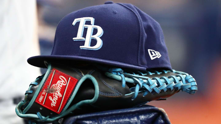 Sep 6, 2019; St. Petersburg, FL, USA; A detail view of a Tampa Bay Rays hat and glove at Tropicana Field.