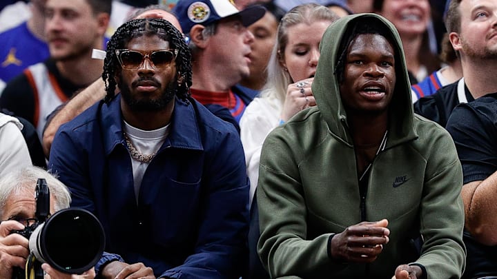 Oct 24, 2023; Denver, Colorado, USA; University of Colorado Buffaloes football players Shedeur Sanders (L) and Travis Hunter (R) watch during the third period between the Denver Nuggets and the Los Angeles Lakers at Ball Arena. Mandatory Credit: Isaiah J. Downing-Imagn Images
