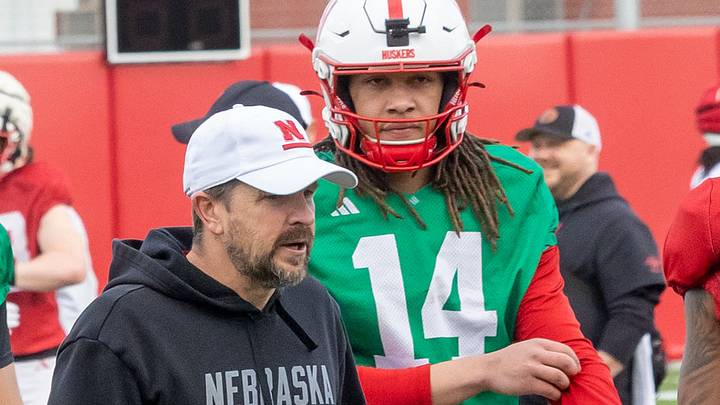 Nebraska quarterbacks coach Glenn Thomas works with TJ Lateef. Nebraska quarterbacks coach Glenn Thomas works with TJ Lateef.