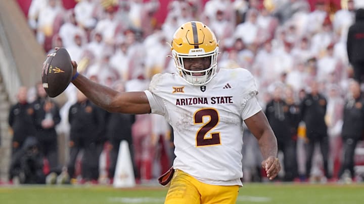 Arizona State Sun Devils quarterback Jeff Sims (2) breaks tackle from Iowa State Cyclones' defensive line Domonique Orange (95) and runs for a first down during the fourth quarter in the Big-12 showdown at jack Trice Stadium on Nov. 1, 2025, in Ames, Iowa. Arizona State Sun Devils quarterback Jeff Sims (2) breaks tackle from Iowa State Cyclones' defensive line Domonique Orange (95) and runs for a first down during the fourth quarter in the Big-12 showdown at jack Trice Stadium on Nov. 1, 2025, in Ames, Iowa.