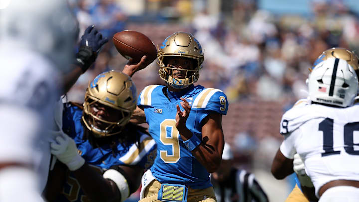Oct 4, 2025; Pasadena, California, USA;  UCLA Bruins quarterback Nico Iamaleava (9) looks to pass during the first quarter against the Penn State Nittany Lions at Rose Bowl. Mandatory Credit: Kiyoshi Mio-Imagn Images