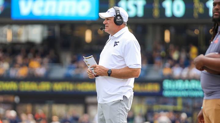 Sep 12, 2026; Morgantown, West Virginia, USA; West Virginia Mountaineers head coach Rich Rodriguez watches during a play during the first quarter against the UT Martin Skyhawks at Milan Puskar Stadium. Mandatory Credit: Ben Queen-Imagn Images Sep 12, 2026; Morgantown, West Virginia, USA; West Virginia Mountaineers head coach Rich Rodriguez watches during a play during the first quarter against the UT Martin Skyhawks at Milan Puskar Stadium. Mandatory Credit: Ben Queen-Imagn Images