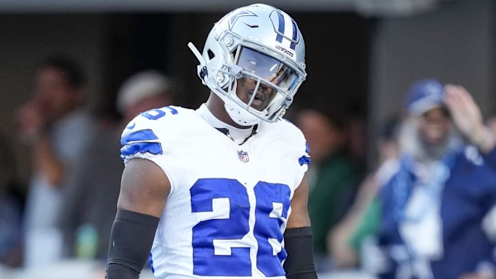 Nov 19, 2023; Charlotte, North Carolina, USA;  Dallas Cowboys cornerback DaRon Bland (26) celebrates his score in the end zone against the Carolina Panthers during the second half at Bank of America Stadium. Mandatory Credit: Jim Dedmon-Imagn Images