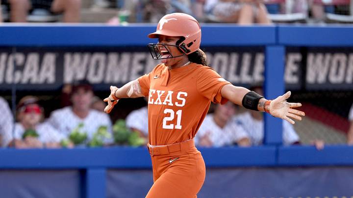 Texas' Longhorns outfielder Kayden Henry (21) celebrates a home run in the fifth inning during a Women's College World Series softball game.