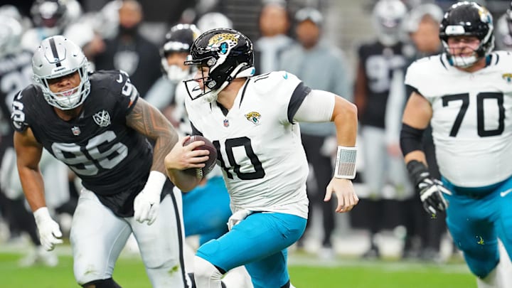 Dec 22, 2024; Paradise, Nevada, USA; Jacksonville Jaguars quarterback Mac Jones (10) gains yardage against the Las Vegas Raiders during the second quarter at Allegiant Stadium. Mandatory Credit: Stephen R. Sylvanie-Imagn Images