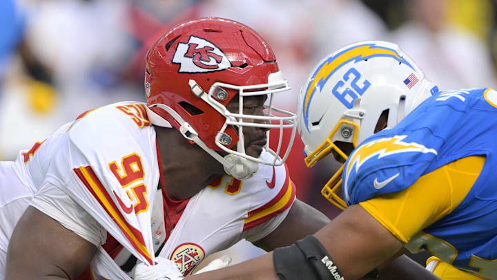Kansas City Chiefs defensive tackle Chris Jones (95) and Los Angeles Chargers center Sam Mustipher (62) battle at the line in the second half at SoFi Stadium. Kansas City Chiefs defensive tackle Chris Jones (95) and Los Angeles Chargers center Sam Mustipher (62) battle at the line in the second half at SoFi Stadium.