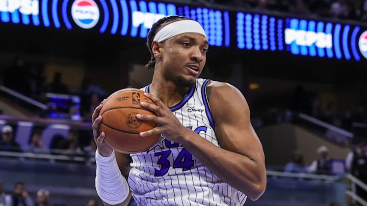 Feb 11, 2026; Orlando, Florida, USA; Orlando Magic center Wendell Carter Jr. (34) grabs the rebound during the first quarter against the Milwaukee Bucks at Kia Center. Mandatory Credit: Mike Watters-Imagn Images
