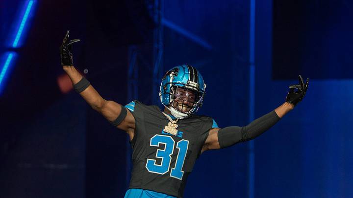 Kerby Joseph (31) walks on stage during the Detroit Lions' new uniform reveal event inside Ford Field in Detroit on Thursday, April 18, 2024.