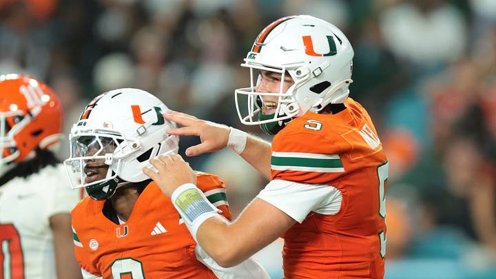Sep 10, 2026; Miami Gardens, Florida, USA;  Miami Hurricanes quarterback Luke Nickel (5) celebrates with Miami Hurricanes wide receiver Vandrevius Jacobs (8) after scoring a touchdown in the third quarter at Hard Rock Stadium.  Mandatory Credit: Sam Navarro-Imagn Images