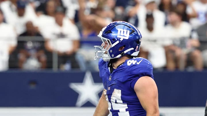 Sep 14, 2025; Arlington, Texas, USA; New York Giants running back Cam Skattebo (44) reacts after scoring a touchdown against the Dallas Cowboys during the fourth quarter at AT&T Stadium.  