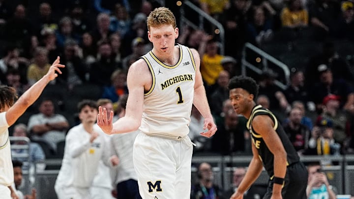 Michigan center Danny Wolf celebrates a 3-point basket against Purdue during the second half of a Big Ten Tournament quarterfinal at Gainbridge Fieldhouse in Indianapolis on Friday, March 14, 2025.