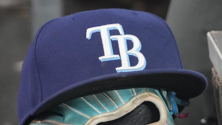 Sep 26, 2025; Toronto, Ontario, CAN; The hat and glove of Tampa Bay Rays third baseman Junior Caminero (13) in the dugout during the game against the Toronto Blue Jays at Rogers Centre. 