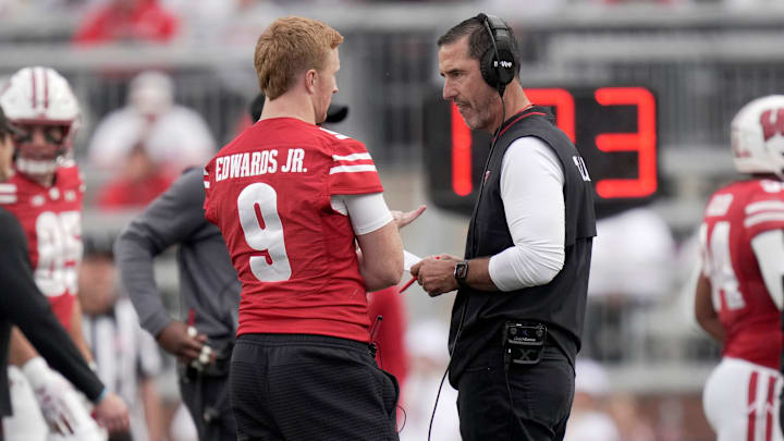 Wisconsin head coach Luke Fickell talks with injured quarterback Billy Edwards Jr. (9) during the fourth quarter of the game Saturday, September 6, 2025 at Camp Randall Stadium in Madison, Wisconsin. Wisconsin beat Middle Tennessee 42-10.