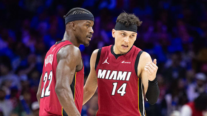 Apr 17, 2024; Philadelphia, Pennsylvania, USA; Miami Heat forward Jimmy Butler (22) and guard Tyler Herro (14) talk as Philadelphia 76ers center Joel Embiid (21) stands behind during the third quarter of a play-in game of the 2024 NBA playoffs at Wells Fargo Center. Mandatory Credit: Bill Streicher-Imagn Images Apr 17, 2024; Philadelphia, Pennsylvania, USA; Miami Heat forward Jimmy Butler (22) and guard Tyler Herro (14) talk as Philadelphia 76ers center Joel Embiid (21) stands behind during the third quarter of a play-in game of the 2024 NBA playoffs at Wells Fargo Center. Mandatory Credit: Bill Streicher-Imagn Images