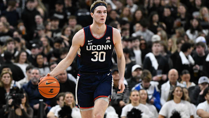 Mar 1, 2025; Providence, Rhode Island, USA; Connecticut Huskies forward Liam McNeeley (30) dribbles against the Providence Friars during the first half at Amica Mutual Pavilion. Mandatory Credit: Eric Canha-Imagn Images Mar 1, 2025; Providence, Rhode Island, USA; Connecticut Huskies forward Liam McNeeley (30) dribbles against the Providence Friars during the first half at Amica Mutual Pavilion. Mandatory Credit: Eric Canha-Imagn Images