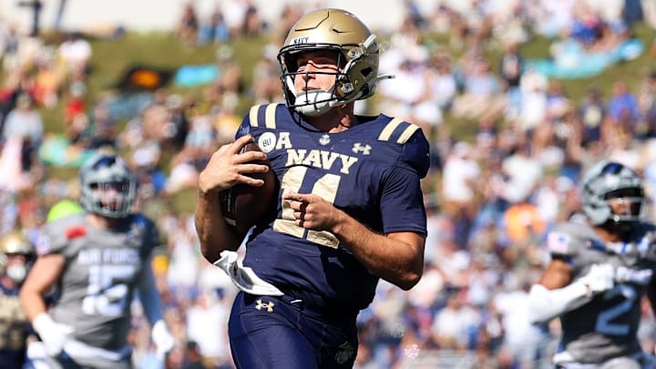 Blake Horvath #11 of the Navy Midshipmen points as he runs the ball to score during the third quarter against the Air Force Falcons at Navy-Marine Corps Memorial Stadium on October 4, 2025 in Annapolis, Maryland.