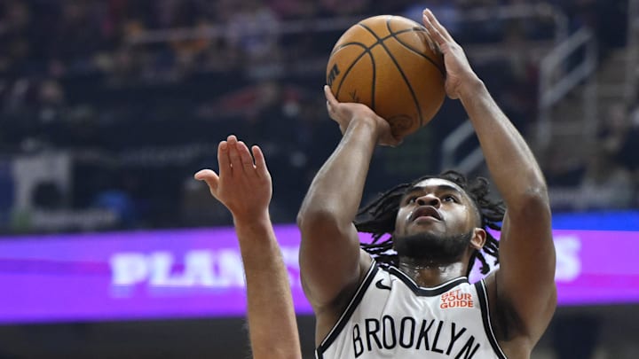 Mar 11, 2025; Cleveland, Ohio, USA; Brooklyn Nets guard Cam Thomas (24) shoots beside Cleveland Cavaliers guard Sam Merrill (5) in the first quarter at Rocket Arena. Mandatory Credit: David Richard-Imagn Images