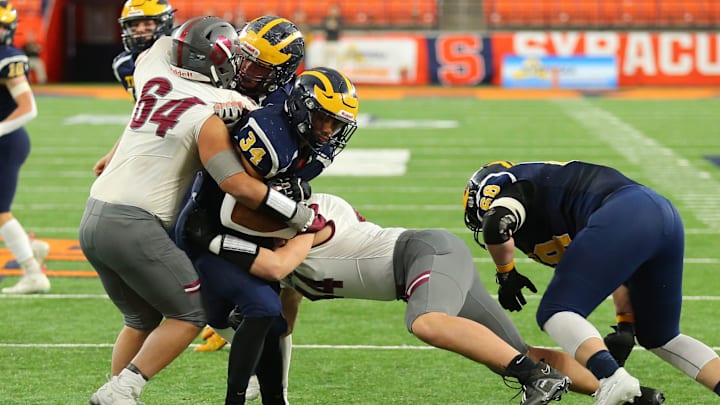 Raikeem Santan and James Cocozzo from Stillwater stop Ousamne Duncanson of Tioga from crossing the goal line. Raikeem Santan and James Cocozzo from Stillwater stop Ousamne Duncanson of Tioga from crossing the goal line.