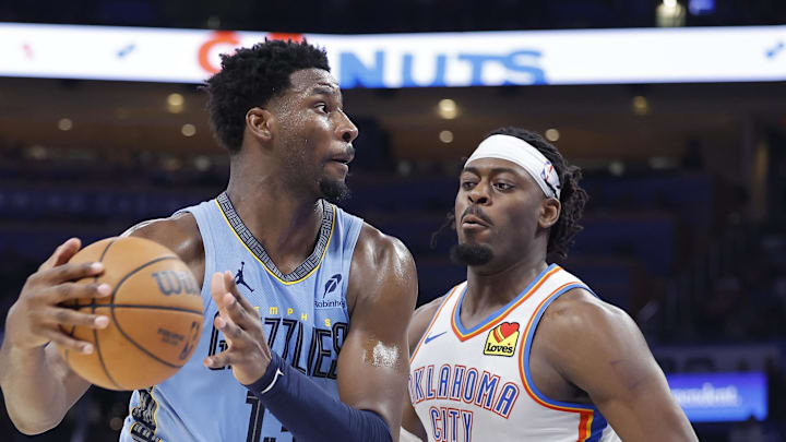 Mar 27, 2025; Oklahoma City, Oklahoma, USA; Memphis Grizzlies forward Jaren Jackson Jr. (13) moves the ball down the court beside Oklahoma City Thunder guard Luguentz Dort (5) during the second half at Paycom Center. Mandatory Credit: Alonzo Adams-Imagn Images