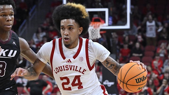 Dec 28, 2024; Louisville, Kentucky, USA; Louisville Cardinals guard Chucky Hepburn (24) dribbles the ball against Eastern Kentucky Colonels guard George Kimble III (3) during the second half at KFC Yum! Center. Louisville won 78-76. Dec 28, 2024; Louisville, Kentucky, USA; Louisville Cardinals guard Chucky Hepburn (24) dribbles the ball against Eastern Kentucky Colonels guard George Kimble III (3) during the second half at KFC Yum! Center. Louisville won 78-76.