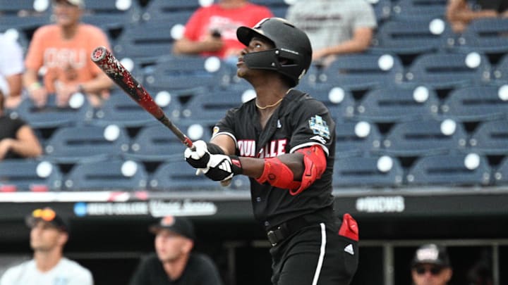 Jun 17, 2025; Omaha, Neb, USA; Louisville Cardinals right fielder Eddie King Jr. (42) hits a sacrifice file to drive in the winning run against the Oregon State Beavers during the ninth inning at Charles Schwab Field. Mandatory Credit: Steven Branscombe-Imagn Images Jun 17, 2025; Omaha, Neb, USA; Louisville Cardinals right fielder Eddie King Jr. (42) hits a sacrifice file to drive in the winning run against the Oregon State Beavers during the ninth inning at Charles Schwab Field. Mandatory Credit: Steven Branscombe-Imagn Images