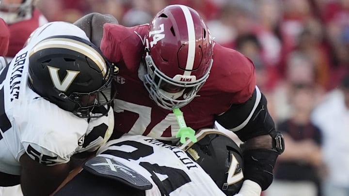 Oct 4, 2025; Tuscaloosa, Alabama, USA;  Alabama offensive lineman Kadyn Proctor (74) blocks both Vanderbilt defensive lineman Aaron Bryant (55) and Vanderbilt linebacker Nick Rinaldi (24) at Saban Field at Bryant-Denny Stadium. Alabama downed Vanderbilt 30-14. Mandatory Credit: Gary Cosby Jr.-Imagn Images