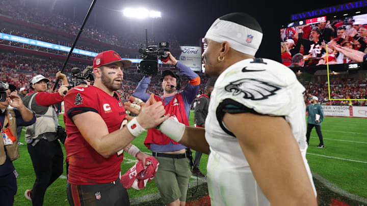 Jan 15, 2024; Tampa, Florida, USA; Tampa Bay Buccaneers quarterback Baker Mayfield (6) and Philadelphia Eagles quarterback Jalen Hurts (1) meet on the field after a 2024 NFC wild card game at Raymond James Stadium. Mandatory Credit: Nathan Ray Seebeck-Imagn Images