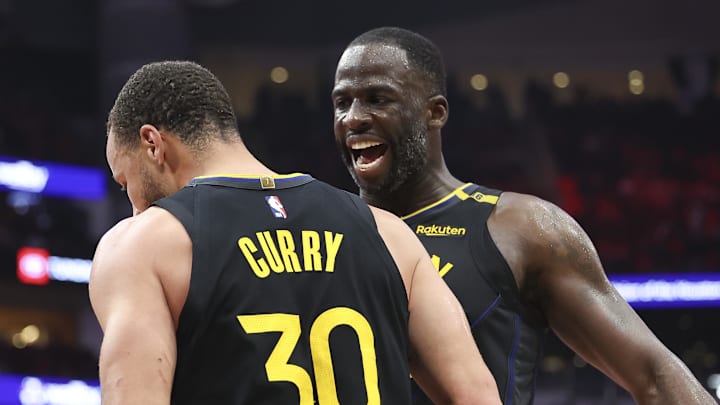 May 4, 2025; Houston, Texas, USA; Golden State Warriors forward Draymond Green (23) celebrates with guard Stephen Curry (30) during game seven of the first round for the 2025 NBA Playoffs against the Houston Rockets at Toyota Center. Mandatory Credit: Troy Taormina-Imagn Images